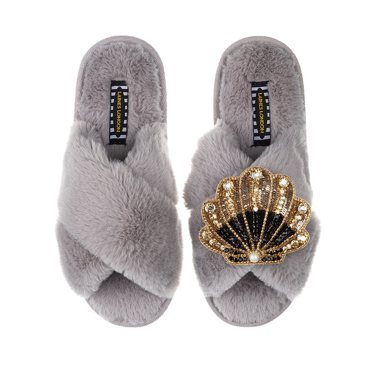 Laines London grey fluffy slippers with black and gold sea shell brooch
