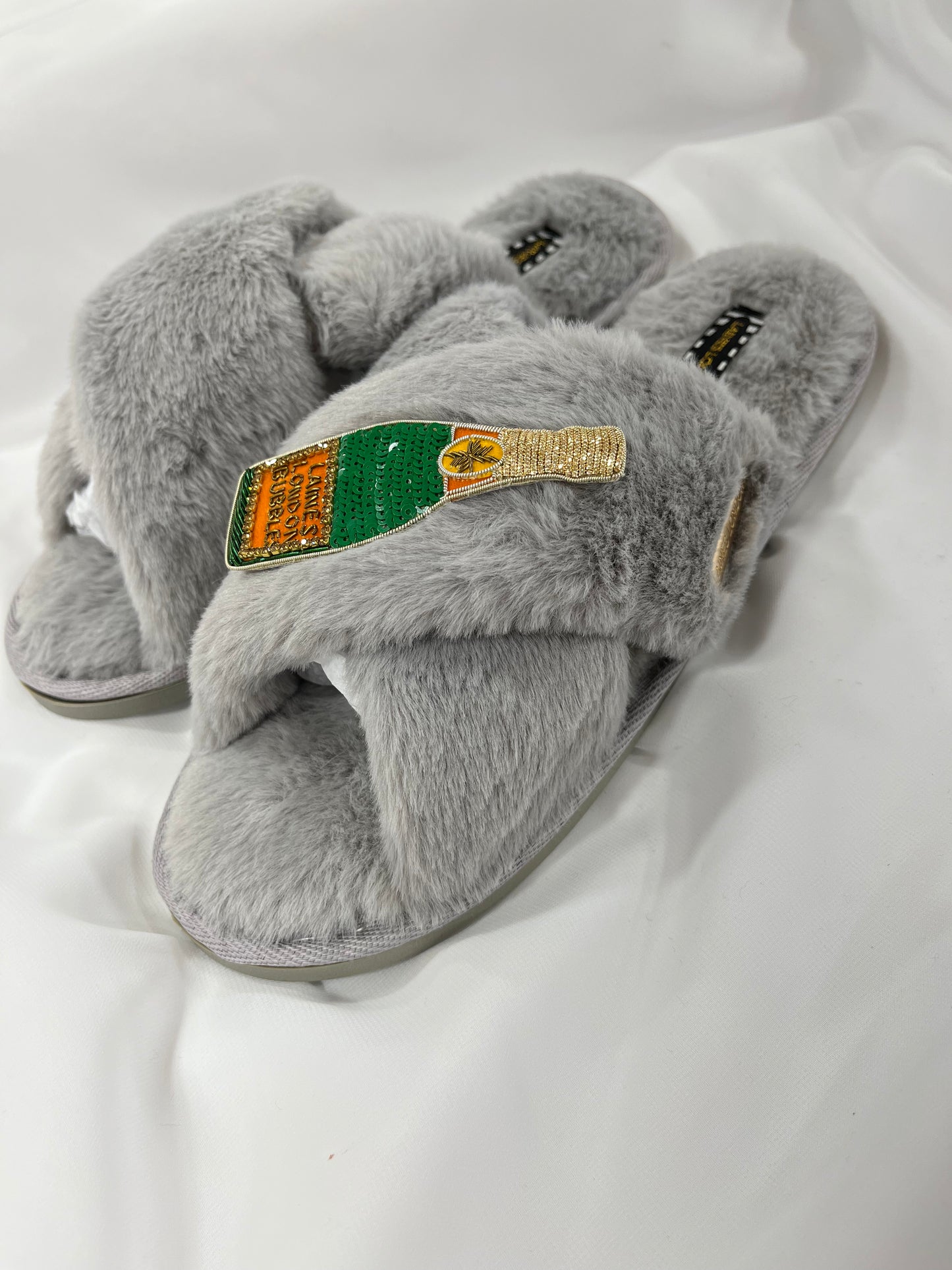 Laines London grey fluffy slippers with champagne brooch