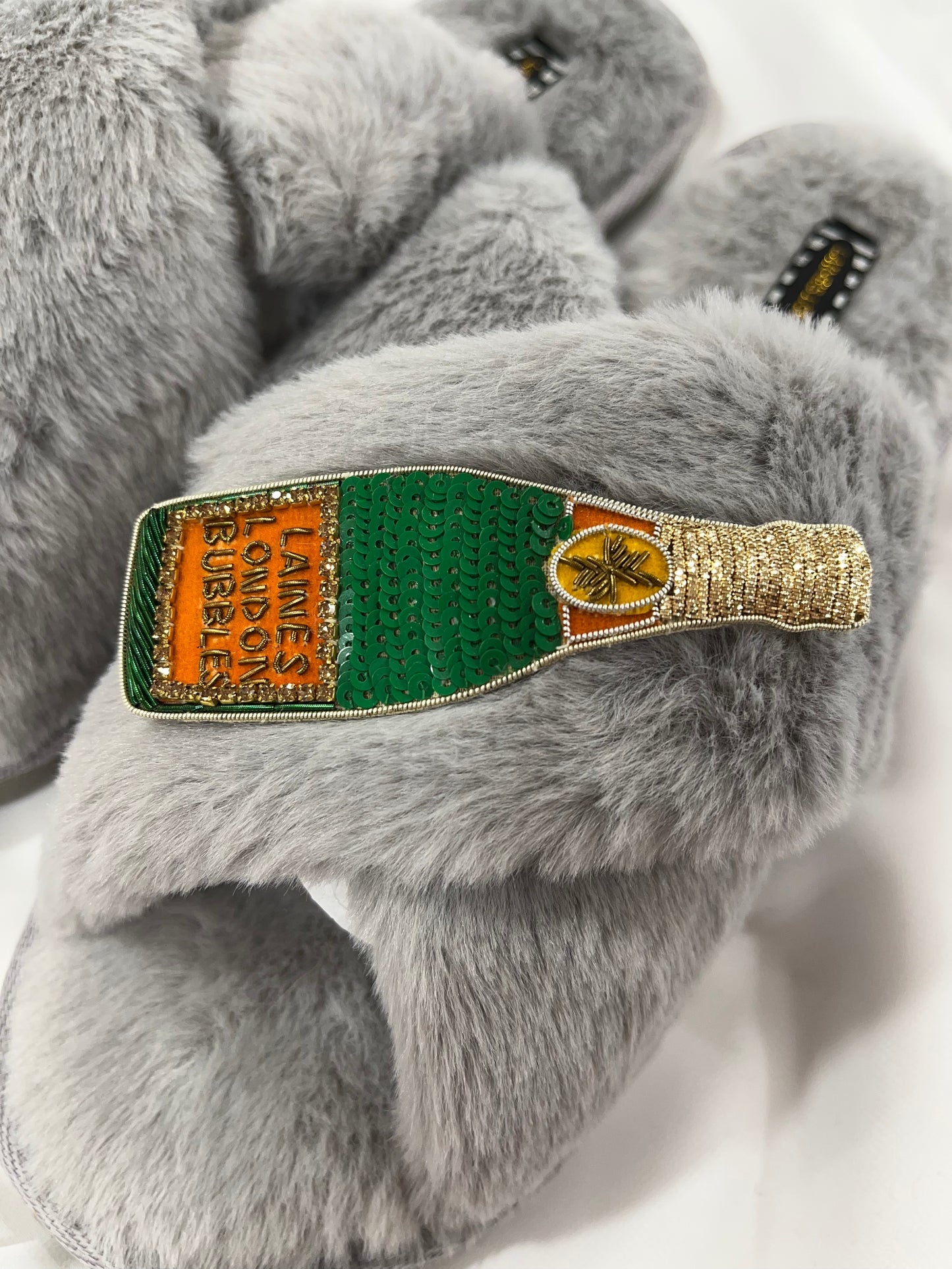 Laines London grey fluffy slippers with champagne brooch