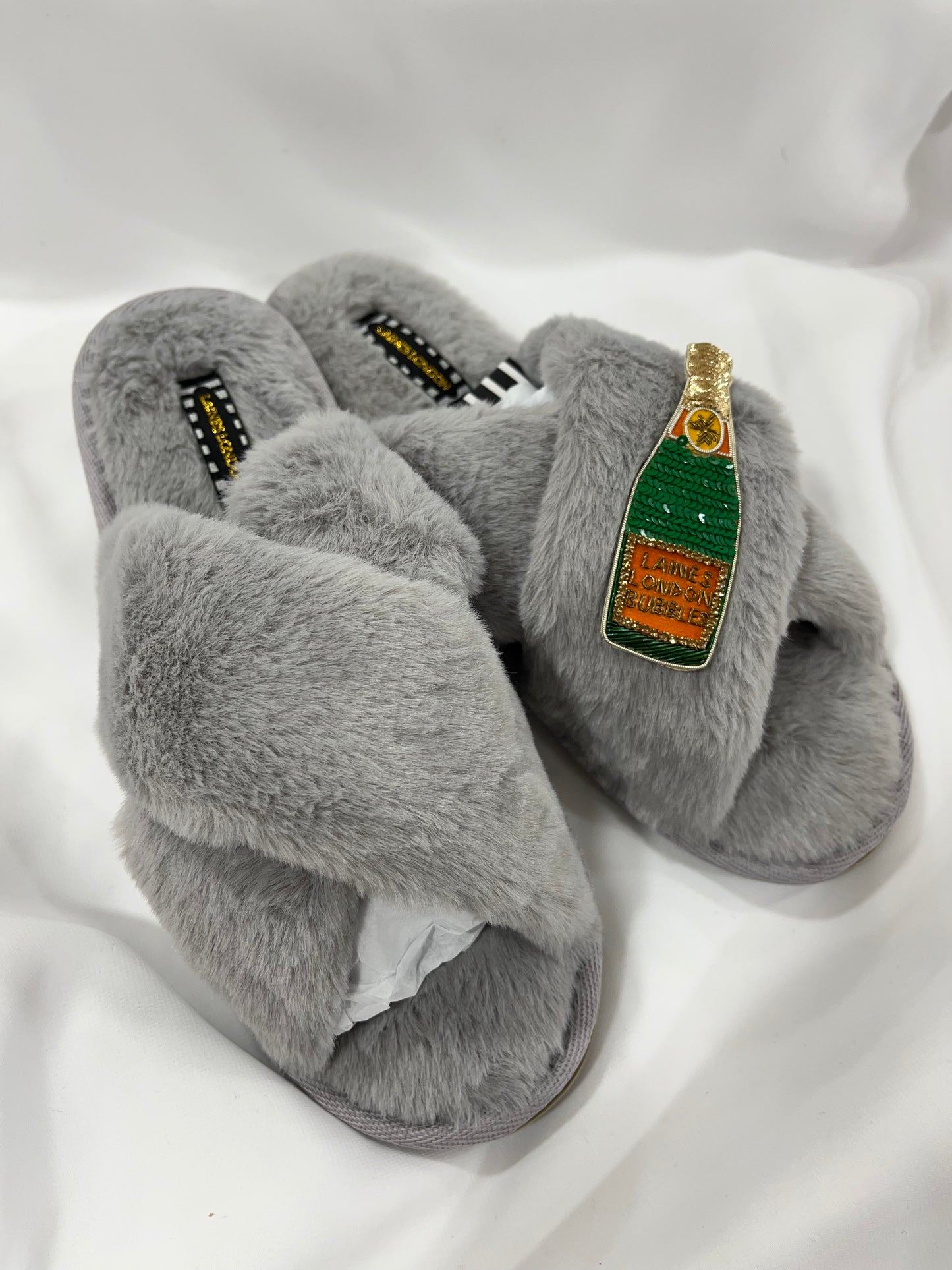 Laines London grey fluffy slippers with champagne brooch