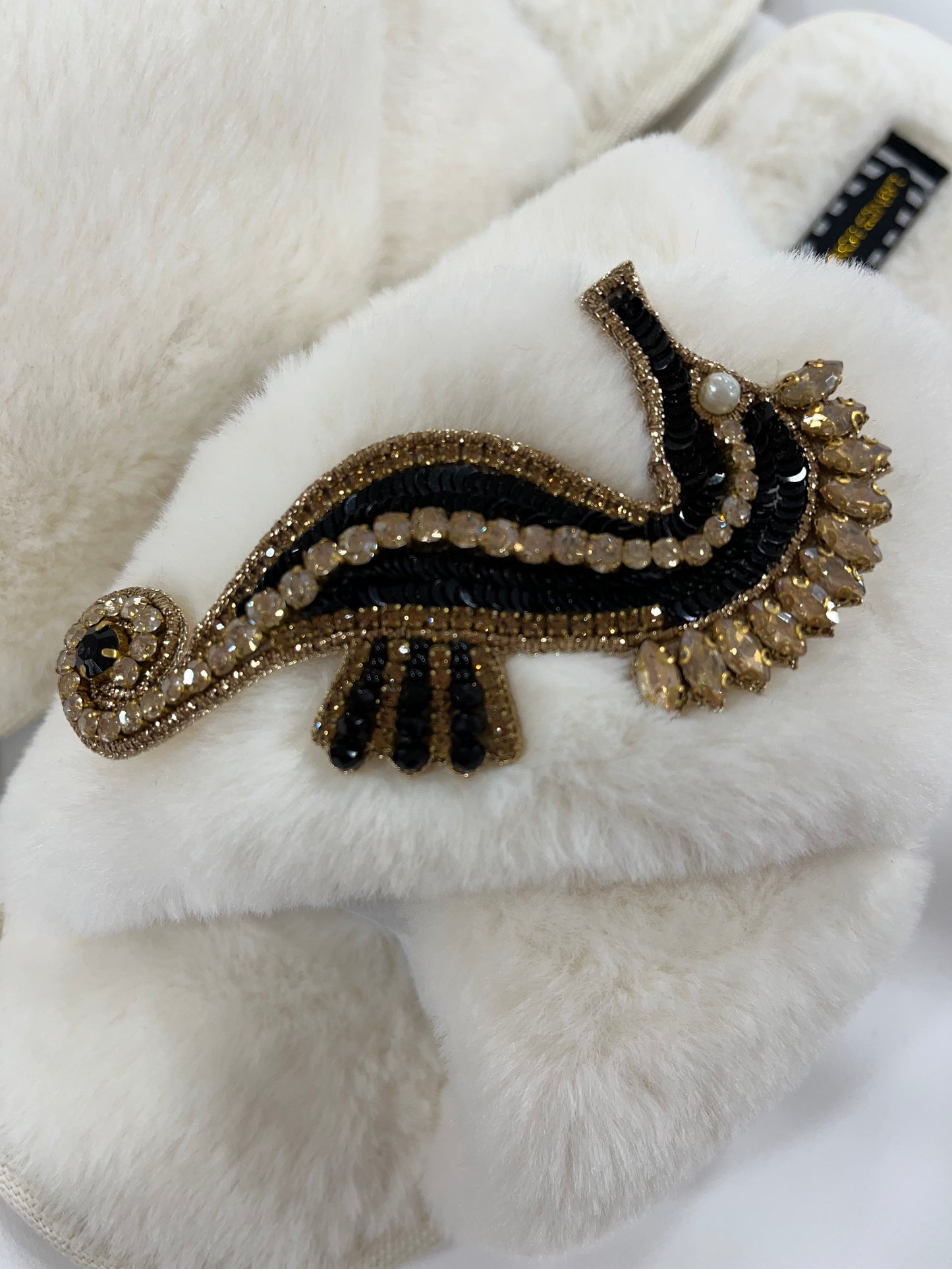 Laines London cream fluffy slippers with black and gold seahorse