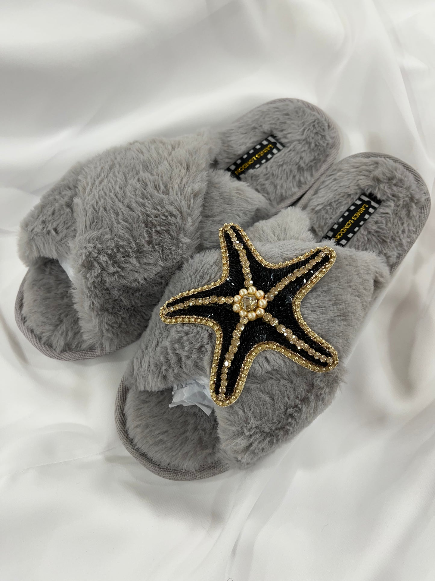 Laines London grey fluffy slippers with black and gold starfish