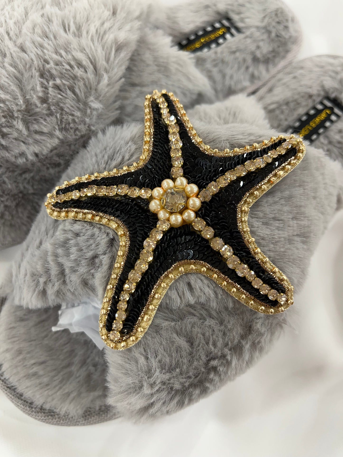 Laines London grey fluffy slippers with black and gold starfish